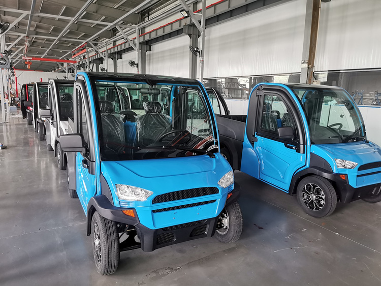Finished electric vans awaiting pre-shipment inspection in China