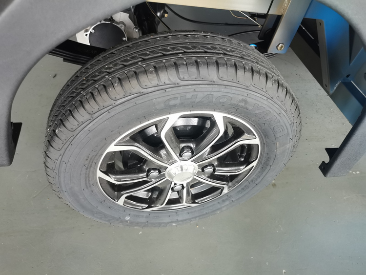 Electric van wheel and tyre checked during quality inspection