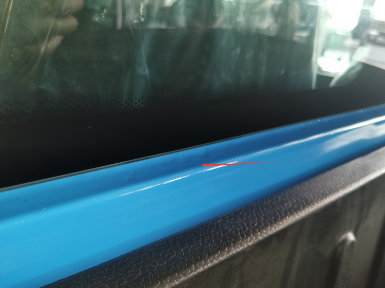 Surface mark found on a blue electric van during inspection