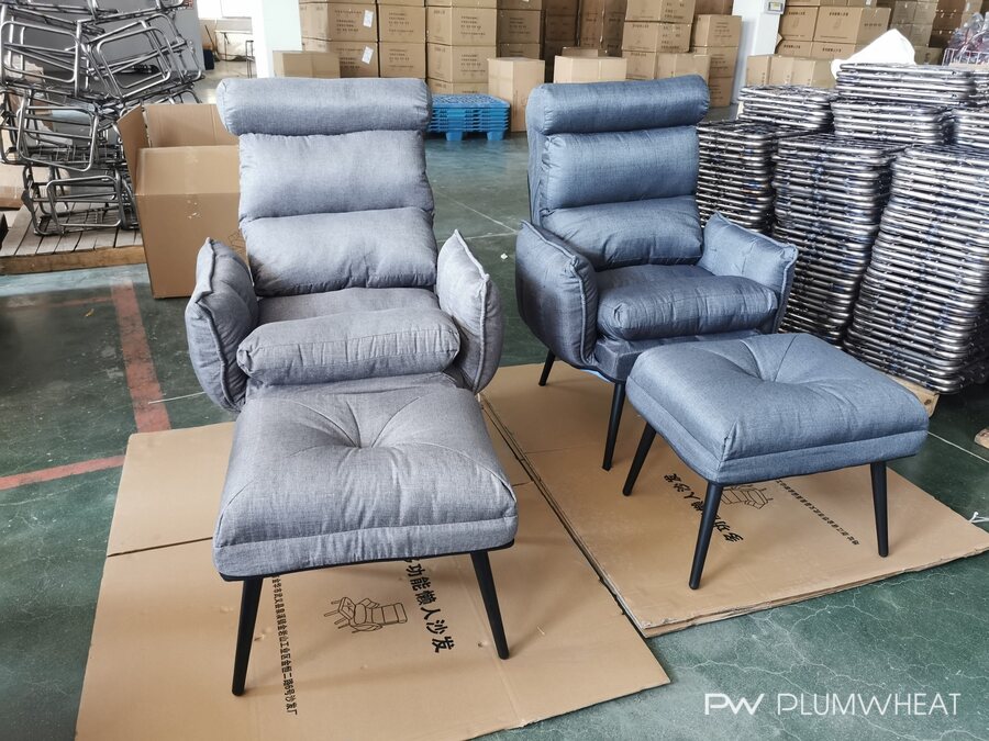 Two grey upholstered leisure chair configurations with matching footstools at a factory.