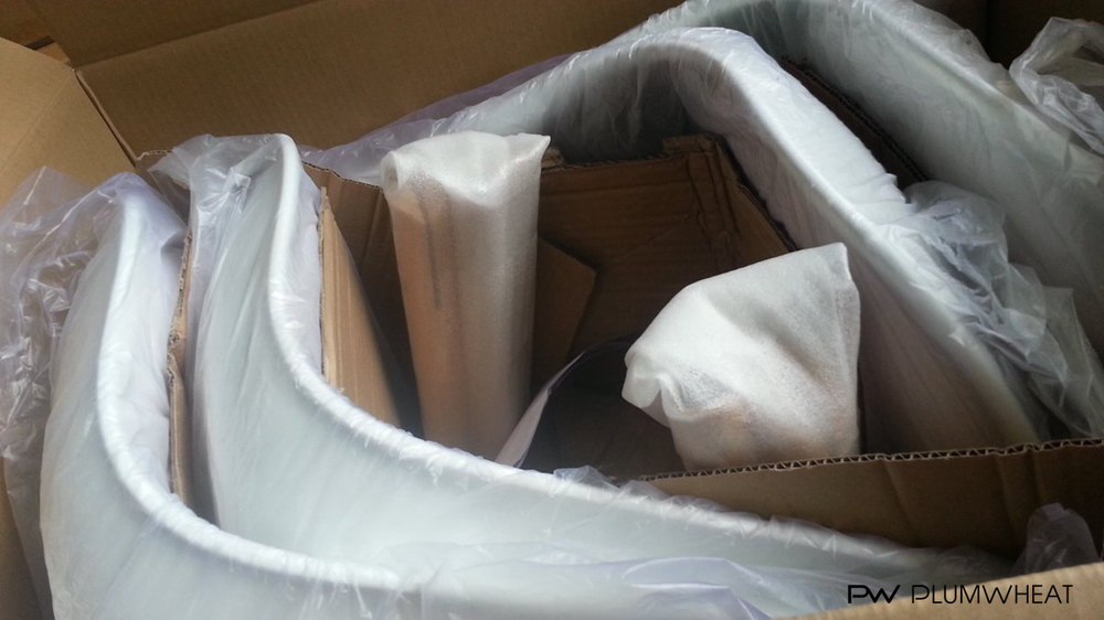 PW818 chair shells and detached legs protected inside an export carton