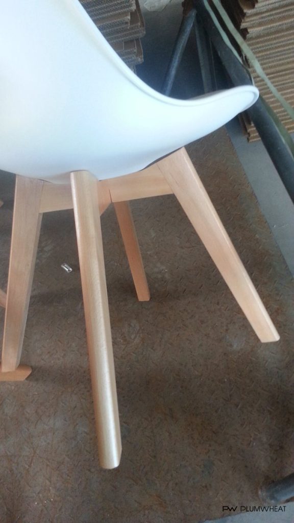 Side view of PW818 chair with square tapered wooden legs