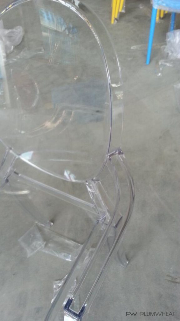 Close view of the clear PW855 polycarbonate chair seat and arm