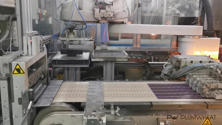 Automated solar cell handling and stringing equipment operating in a Chinese factory