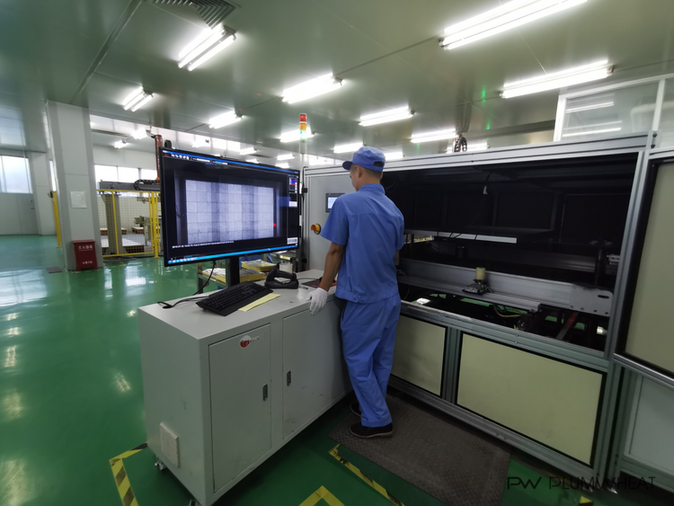 Enclosed solar module testing equipment inside a factory in China